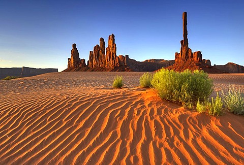 Sand dunes in front of Totem Pole and Yei Bi Chei rock formation, Monument Valley, Navajo Tribal Park, Navajo Nation Reservation, Arizona, Utah, United States of America, USA