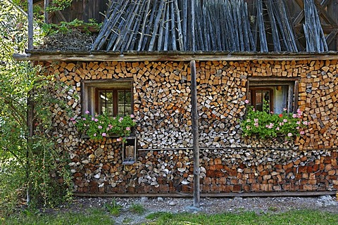 A wood pile and hay drying racks, Bauernhausmuseum Amerang farmhouse museum, Amerang, Bavaria, Germany, Europe