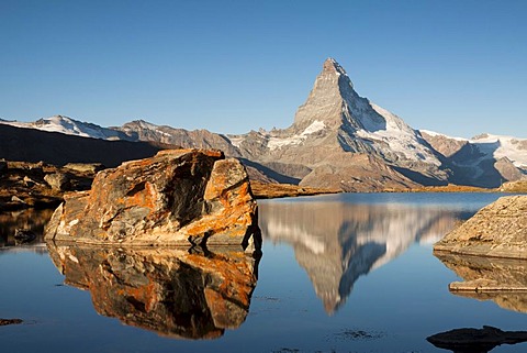 Mt Matterhorn, 4478 m, reflected in Stellisee Lake in the morning, from Stellisee Lake, Canton Valais, Switzerland, Europe, PublicGround