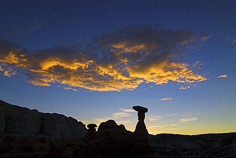 Silhouettes of the hoodoos, rock formations, of the Rimrocks area, Toadstool Valley, at sunrise, in southern Utah, USA