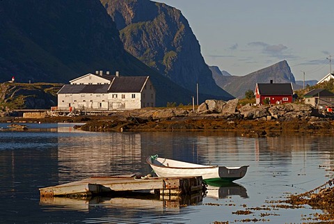 Houses and a boat illuminated by warm morning light, at MÃŠrvollspollen, Nordland, Norway, Europe