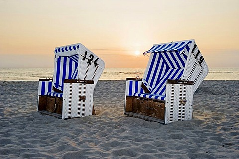 Roofed wicker beach chairs on the beach at sunset, List, Sylt, Schleswig-Holstein, Germany, Europe