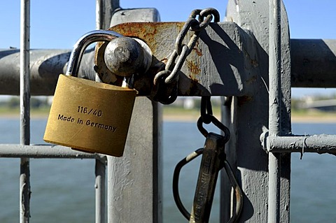 Padlock, Made in Germany, at a barrier fence along the Rhine Promenade, Duesseldorf, North Rhine-Westphalia, Germany, Europe