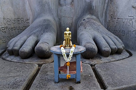 The small statue of Bahubali at the feet of the gigantic statue of Gomateshwara in Sravanabelagola, used for special rituals, Karnataka, India, Asia