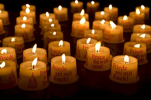 Candles as offerings for peace inside the Frauenkirche church, Dresden, Saxony, Germany, Europe