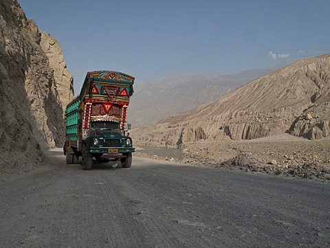 Colourfully decorated truck making its way up the Karakorum Highway, Chillas, North West Frontier, Pakistan, South Asia