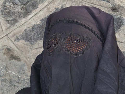 Muslim woman dressed in a burka, in traditional area of Srinagar, Jammu and Kashmir, India, Asia