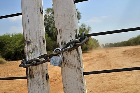 Locked gate, property owned by a big landowner, Gran Chaco region, Salta province, Argentina, South America