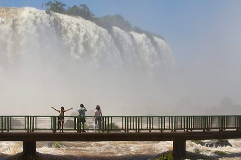 Tourists on a footbridge in front of the Iguazu or Iguacu falls, Brazilian side, Unesco National Park, Misiones Province, Argentina, South America