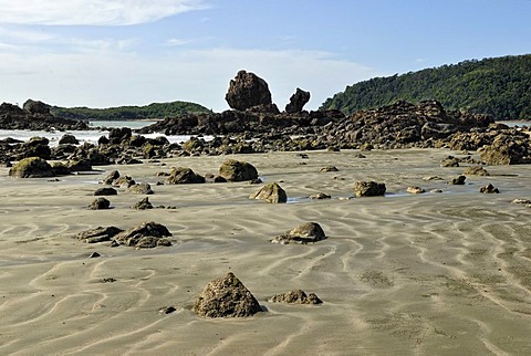 Sandy beach with volcanic rocks, Cape Hillsborough National Park near Mackay, Queensland, Australia