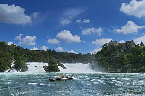 Rhine Falls near Schaffhausen, a boat cruising in front of it, Switzerland, Europe