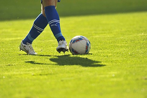 Footballer's legs and a football, Sinsheim-Hoffenheim WIRSOL, Rhein-Neckar-Arena, Baden-Wuerttemberg, Germany, Europe