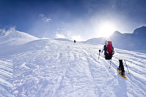 Snowshoe hiker climbing the Kleine Kreuzspitze Mountain in Racines above Sterzing, Alto Adige, Italy, Europe