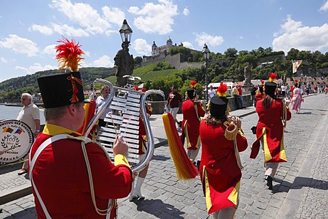 Parade in traditional costume during the Kiliani Festival, on Old Main bridge with Fortress Marienberg in the distance, Wuerzburg, Lower Franconia, Franconia, Bavaria, Germany, Europe, PublicGround