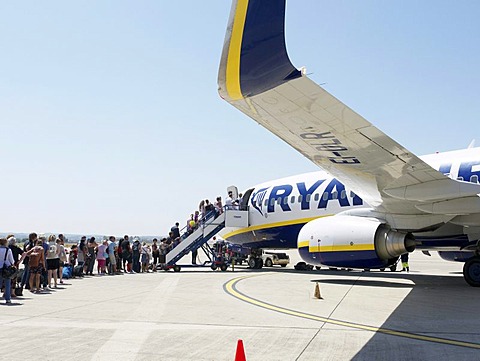 Ryanair passengers in a queue at the airfield waiting to board an airplane, Frankfurt-Hahn Airport, Rhineland-Palatinate, Germany, Europe