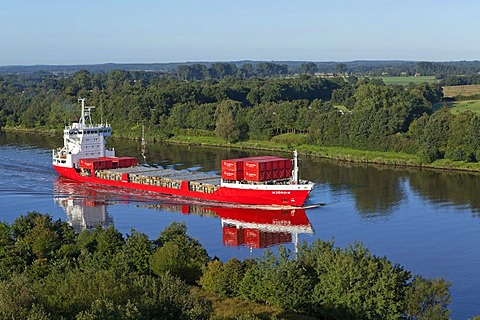 Container ship on the Kiel Canal near Schafstedt, Schleswig-Holstein, Germany, Europe