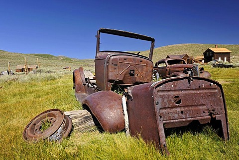 Rusty cars, at the rear, a 1937 Chevrolet Chevy, ghost town of Bodie, a former gold mining town, Bodie State Historic Park, California, United States of America, USA