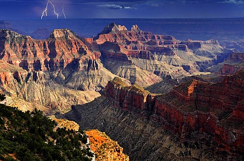 Thunderstorm with a lightning strike, view from Bright Angel Point towards Deva Temple, Brahma Temple, Zoroaster Temple, Transept Canyon, Bright Angel Canyon, sunset, evening mood, Grand Canyon National Park, North Rim, Arizona, United States of America, 