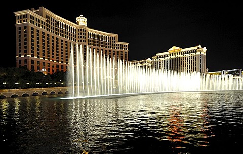 Night scene, water display in front of luxury hotels, casinos, Bellagio, Caesars Palace, The Mirage, Las Vegas, Nevada, United States of America, USA, PublicGround