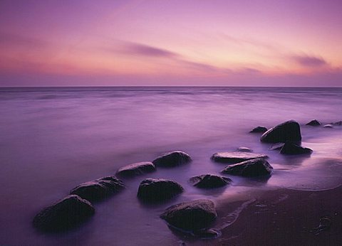 Dream landscape - sea and stones in the dawn