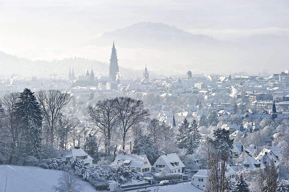 Christmassy and snowy panorama of Freiburg im Breisgau, Black Forest, Baden-Wuerttemberg, Germany, Europe