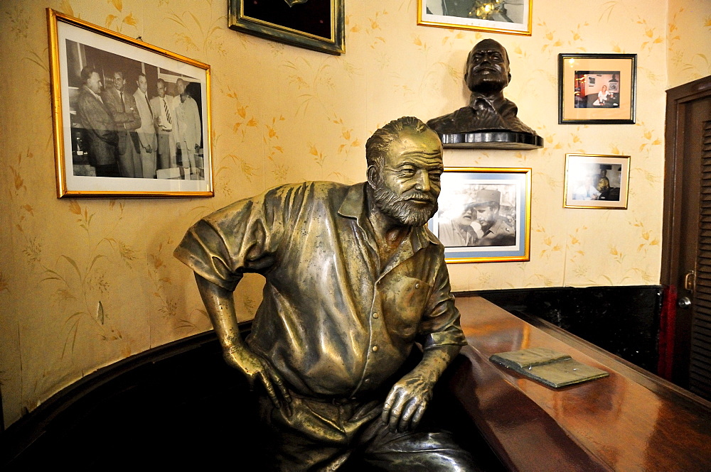 Bronze statue of Ernest Hemingway in the Bar Floridita, Hemingway's favorite bar in the old town Habana Vieja, Havana, Cuba, Caribbean