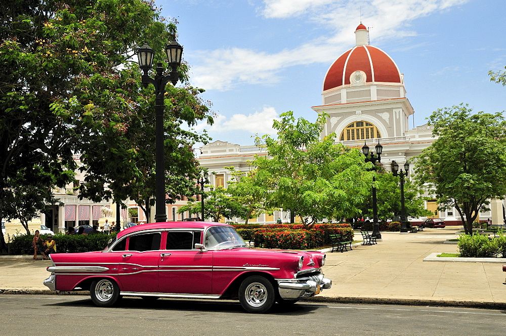 Pontiac, classic car parked in front of the Provincial History Museum next to Parque Marti park, Cienfuegos, Cuba, Caribbean