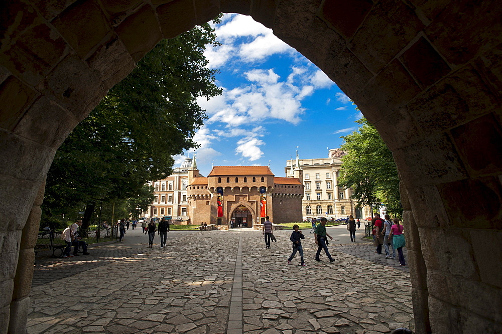 Krakow barbican city gate seen through the St. Florian's Gate or Brama Florianska, UNESCO World Heritage Site, Krakow, Malopolska, Poland, Europe, PublicGround