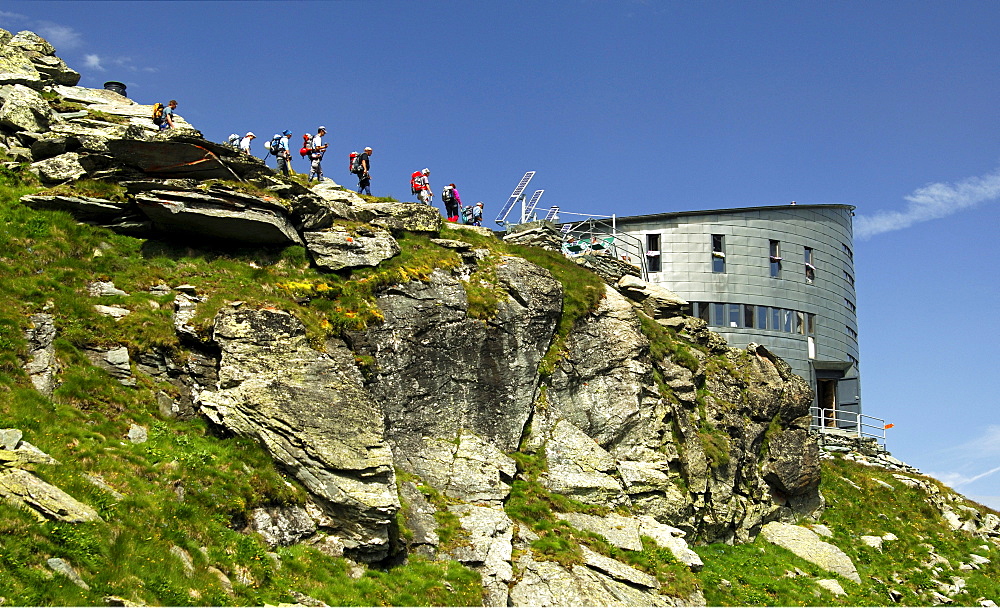 Group of hikers arriving at Velan Hut, Cabane du Velan, of the Swiss Alpine Club, SAC, Valais Alps, Valais, Switzerland, Europe