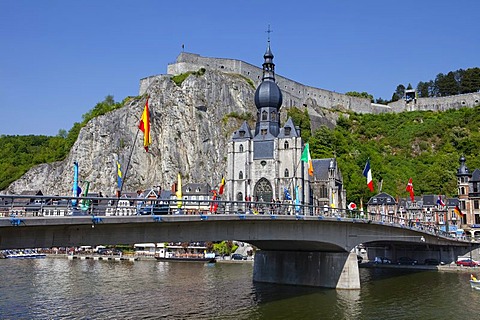 Pont du Charles de Gaulle bridge over the Meuse river with colorful saxophones as memorials to Adolphe Sax, Collegiate Church of Notre-Dame and Citadel, Dinant on the Meuse, Namur, Wallonia, Belgium, Europe