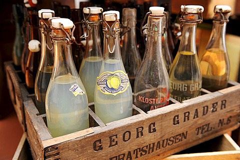 Old beverage bottles with swing tops in a wooden box, Heimatmuseum Wolfratshausen museum for local history, Upper Bavaria, Bavaria, Germany, Europe