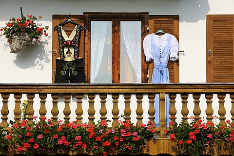 Farmhouse with lederhosen and a dirndl hanging on the shutters, Reichersbeuern, district of Bad Toelz - Wolfratshausen, Upper Bavaria, Bavaria, Germany, Europe, PublicGround