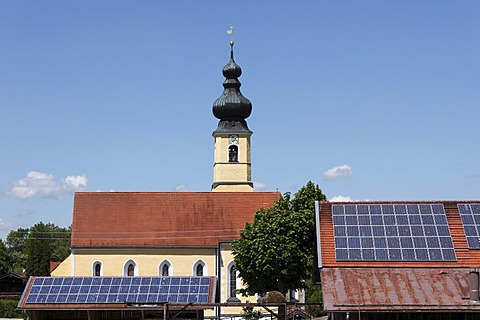 Church of the Nativity behind barnroofs with solar panels, Frauenried, Irschenberg district, Upper Bavaria, Bavaria, Germany, Europe