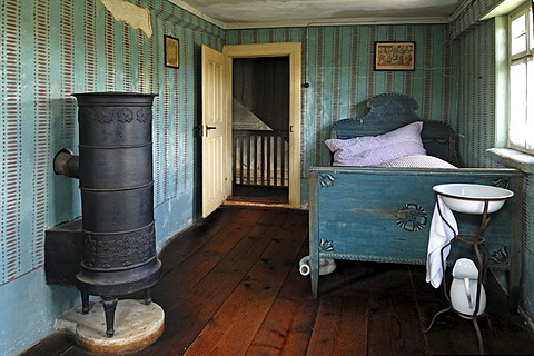 Retiree's room with stove and bed, 1911, farmhouse from Herrnbechtheim, Franconian open-air museum, Eisweiherweg 1, Bad Windsheim, Middle Franconia, Bavaria, Germany, Europe