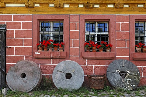 Three millstones from a mill in Unterschlauersbach, 1575, Franconian Open Air Museum, Eisweiherweg 1, Bad Windsheim, Middle Franconia, Bavaria, Germany, Europe