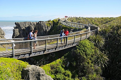 Tourists visiting the rock formations of Pancake Rocks Punakaiki, Paparoa National Park, South Island, New Zealand