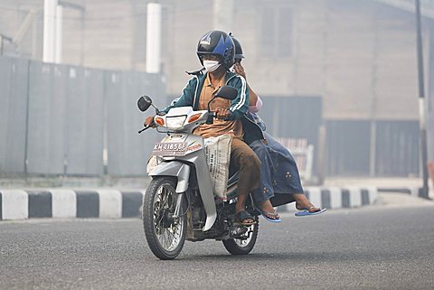 Smog in the streets of Pangkalanbun, Central-Kalimantan, Borneo, Indonesia