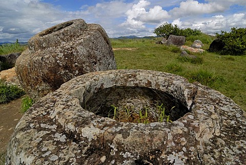 Archeology, ancient large stone jars scattered in the landscape, Plain of Jars, Jar Site 1, Thong Hai Hin, near Phonsavan, province of Xieng Khouang, Laos, Southeast Asia