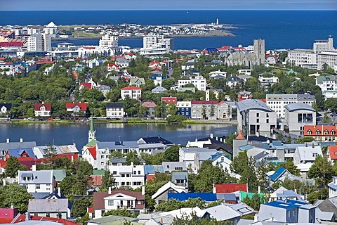 Downtown from the tower of the Hallgrimskirkja church with Tjoernin city lake with and city hall, Reykjavik, Iceland, Europe