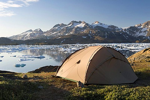 Tent, floating ice sheets and mountains, Tasiilaq or Ammassalik, East Greenland, Greenland