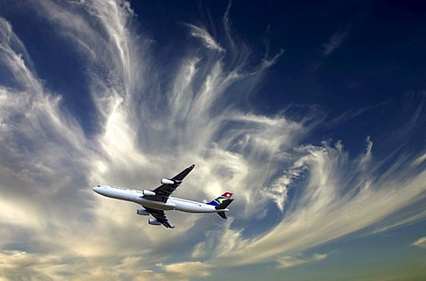 South African Airbus A340-600 jet aircraft against cloudy sky