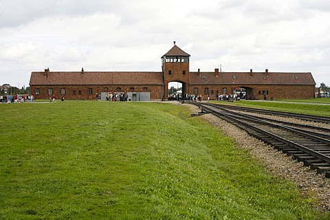 Entrance gate and rail tracks to the concentration camp, Auschwitz-Birkenau, Poland, Europe