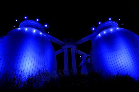 Digester towers illuminated at night, Bochum, North Rhine-Westphalia, Germany, Europe