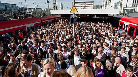 Many people on their way to the Wiesn or Oktoberfest grounds, S-Bahnhof Hackerbruecke station, Munich, Bavaria, Germany, Europe