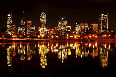 Skyline of Montreal reflected in the St. Lawrence River, Montreal, Quebec, Canada