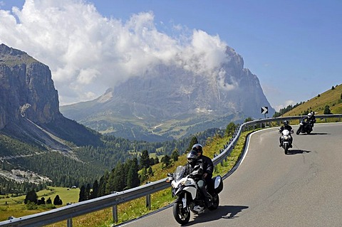 Motorcyclists in front of the Langkofel massif on the Gardena Pass Road, South Tyrol, Italy, Europe