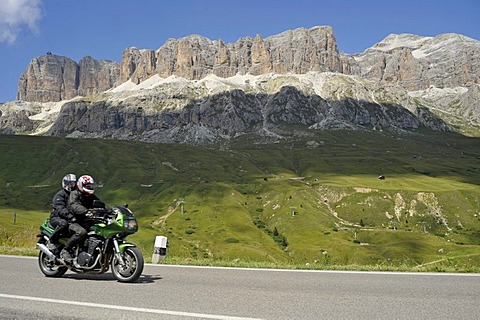 Motorcyclists in front of the Sella massif on the Pordoi pass, South Tyrol, Italy, Europe