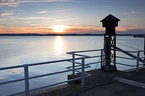 Old fog horn on the pier in Meersburg on Lake Constance, overlooking the lake towards Konstanz at sunset, Baden-Wuerttemberg, Germany, Europe