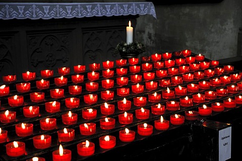 Burning votive candles in a church, St. Martin's Church, Landshut, Lower Bavaria, Bavaria, Germany, Europe