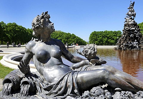 Mythological figure on the edge of the pond of the Fama Fountain, by Rudolf Maison 1884-85, in front of the Schloss Herrenchiemsee Palace, Herrenchiemsee, Bavaria, Germany, Europe